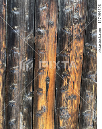 Background material of wooden boards. Background material with a solid antique wood grain. Door boards, wall boards, planks, flooring, wooden floors Background material of wooden boards. Background material with a solid antique wood grain. Door boards, wall boards, planks, flooring, wooden floors 127494808