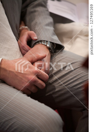 Intimate Handholding at a Unique and Special Event to Celebrate Relationships and Bonds 127495169