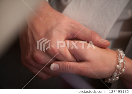 Experiencing an Emotional Connection through Handholding at a Significant Special Moment in Life Experiencing an Emotional Connection through Handholding at a Significant Special Moment in Life 127495185