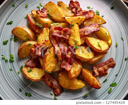 Roasted potatoes and chopped crispy bacon. 127495420