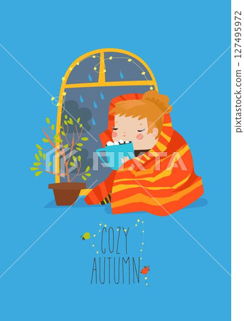 Girl drinking a cup of tea or coffee by window with rain 127495972
