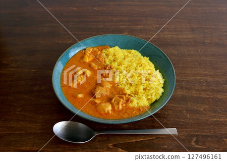 Butter chicken curry on table background Butter chicken curry on table background 127496161