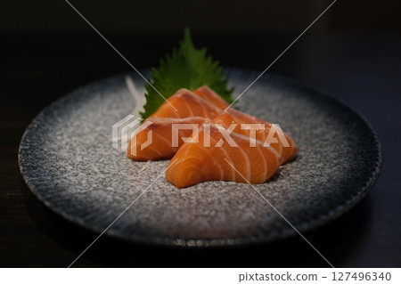 Salmon sashimi with Wasabi on pottery dish Salmon sashimi with Wasabi on pottery dish 127496340