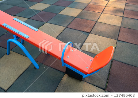 Rubber coating and flip flap swing at the playground at preschool. 127496408