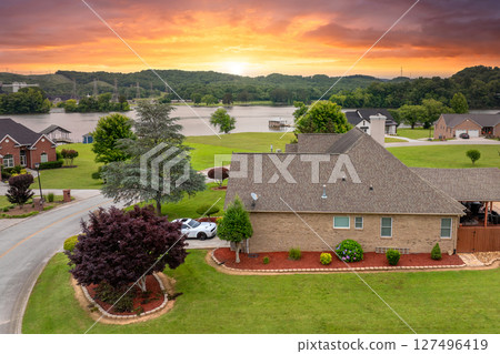Rich neighborhood with expensive residential homes in Kingston, Tennessee. Wealthy suburban area Rich neighborhood with expensive residential homes in Kingston, Tennessee. Wealthy suburban area 127496419