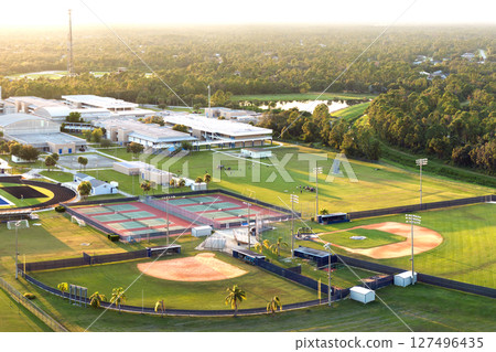 Public high school sports facilities in Florida. American football stadium, tennis courts and baseball diamond sport infrastructure 127496435