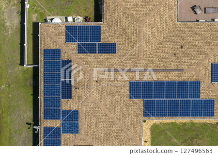 Photovoltaic solar panels on Florida home roof for producing clean ecological electric energy. Renewable electricity with zero emission concept 127496563