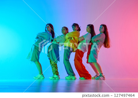 Youthful dance crew expressing vibrant urban culture through diverse creative movements Youthful dance crew expressing vibrant urban culture through diverse creative movements 127497464
