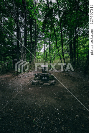 A prayer altar in the quiet forest of the inner shrine of Arayayama Shrine - a power spot for good fortune 127497512
