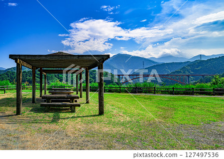 A gazebo on the grassy field and the Miyagase mountains in the distance. Lake Miyagase, Kiyokawa Village, Aiko District, Kanagawa Prefecture A gazebo on the grassy field and the Miyagase mountains in the distance. Lake Miyagase, Kiyokawa Village, Aiko District, Kanagawa Prefecture 127497536