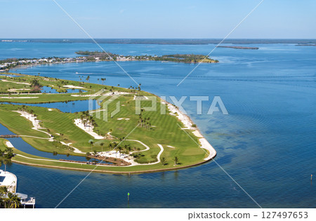 Large golf course and sports grounds with green grass in Boca Grande, small town on Gasparilla Island in southwest Florida Large golf course and sports grounds with green grass in Boca Grande, small town on Gasparilla Island in southwest Florida 127497653