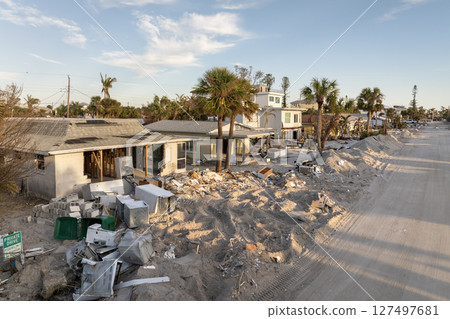 Hurricane Milton on Manasota Key in Englewood, Florida. Piles of rubbish on street side from severely damaged houses. Consequences of natural disaster 127497681