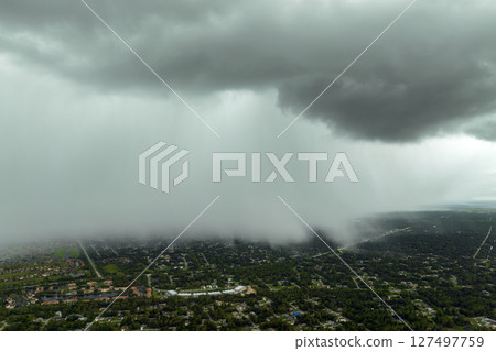 Heavy rainfall over Florida suburbs during summer thunderstorm 127497759