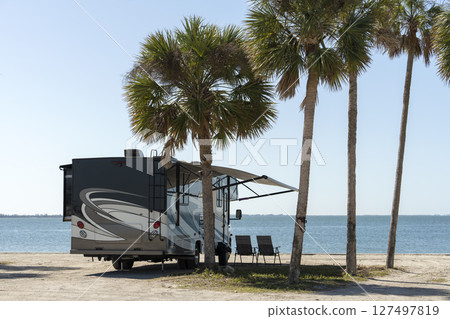 Florida travel destination. Motorhome recreational vehicle on seaside. Florida travel destination. Motorhome recreational vehicle on seaside. 127497819
