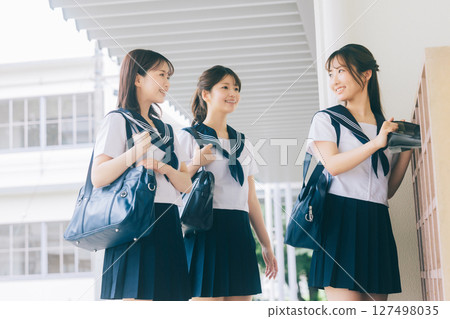 A high school girl greets in front of the shoe locker A high school girl greets in front of the shoe locker 127498035