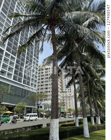 vertical photos vietnam danang beach Beautiful My Khe beach from drone in Da Nang, Vietnam, street and buildings near the Central beach and the sea. Photo from a drone 127498547