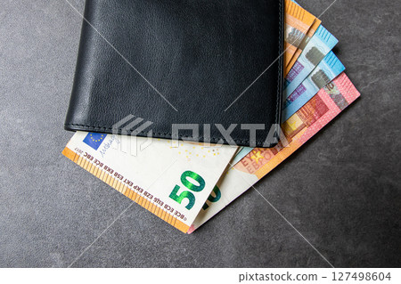 Black partmone with european money. Bills in leather wallet for commerce concept. 127498604
