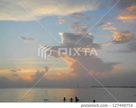 Cloud angel appears on the beach of Grand Cayman in the Caribbean Cloud angel appears on the beach of Grand Cayman in the Caribbean 127498758
