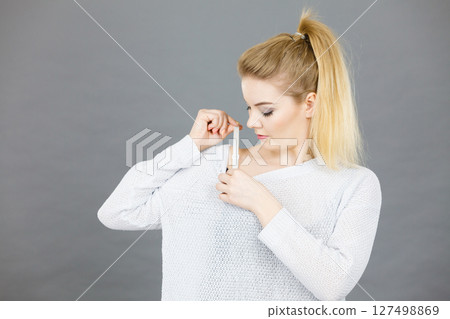 Woman holding her bra strap Woman holding her bra strap 127498869