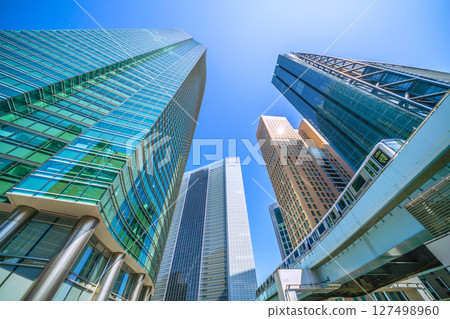 Tokyo cityscape, Japan, June 19th. View of Shiodome business district and Yurikamome line. Tokyo cityscape, Japan, June 19th. View of Shiodome business district and Yurikamome line. 127498960