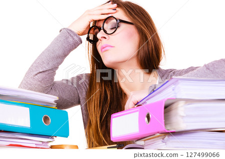 woman tired with stack of folders documents woman tired with stack of folders documents 127499066