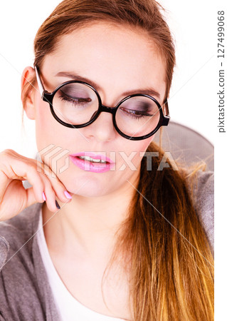 Young serious business woman thinking Young serious business woman thinking 127499068