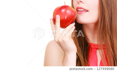 Woman charming girl holds apple fruit Woman charming girl holds apple fruit 127499080