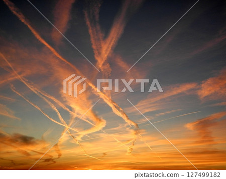 A contrail in the sunset on the outskirts of Phoenix A contrail in the sunset on the outskirts of Phoenix 127499182