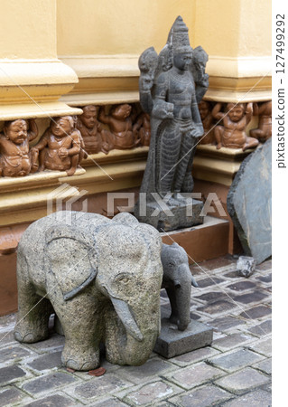 Gangaramaya Temple, Colombo, Sri Lanka. Intricately crafted stone elephants 127499292