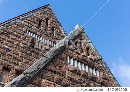 Close-up of a historic brick and stone building facade 127499296