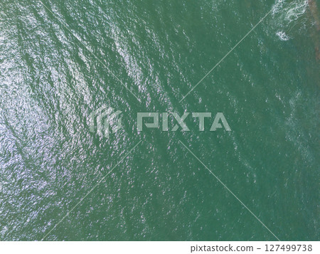 Smooth green color ocean surface Smooth green color ocean surface 127499738