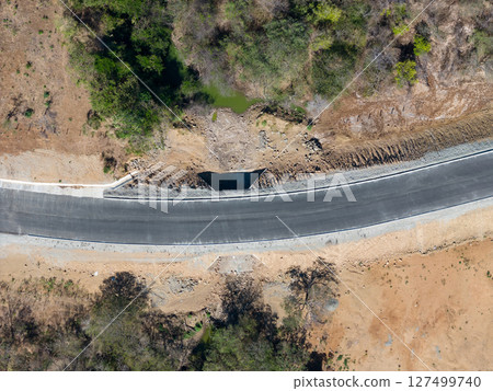Empty curved asphalt road 127499740