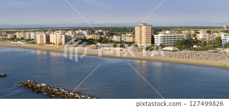 Drone view of Lido Adriano sandy beaches with umbrellas and gazebos Drone view of Lido Adriano sandy beaches with umbrellas and gazebos 127499826
