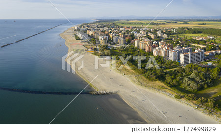 Drone view of italian sandy beaches with umbrellas and gazebos 127499829