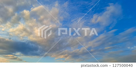 Evening sky with yellowish-gray clouds. Evening sky with yellowish-gray clouds. 127500040