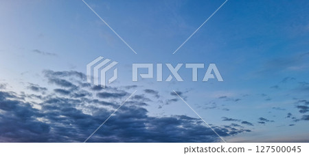 Evening sky with yellowish-gray clouds. 127500045