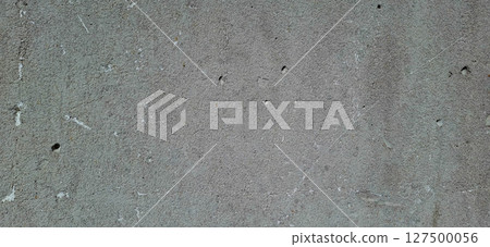 The surface of an old concrete slab. Traces of gray paint on concrete. 127500056