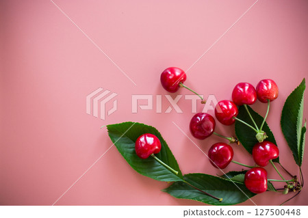 Ripe cherries isolated on pink background Ripe cherries isolated on pink background 127500448