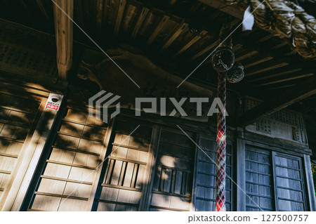 The quaint wooden carving of the shrine name and bell at the main hall of Kumano Shrine, Yokosuka, Kanagawa Prefecture 127500757