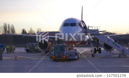 Berlin, Germany, December 10, 2015: Air Berlin A320 Boarding via Mobile Stairway at Tegel Airport in Early Morning Berlin, Germany, December 10, 2015: Air Berlin A320 Boarding via Mobile Stairway at Tegel Airport in Early Morning 127501239
