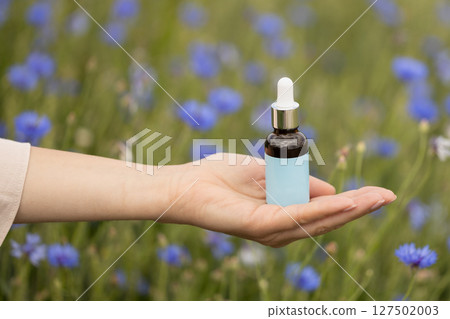 Cosmetic Dropper Bottle Mockup in Wildflower Field Cosmetic Dropper Bottle Mockup in Wildflower Field 127502003