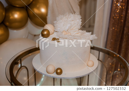 Elegant White Feather Cake with Gold Accents on a Tiered Stand for a Sophisticated Celebration, Luxury Dessert and Party Theme Elegant White Feather Cake with Gold Accents on a Tiered Stand for a Sophisticated Celebration, Luxury Dessert and Party Theme 127502332