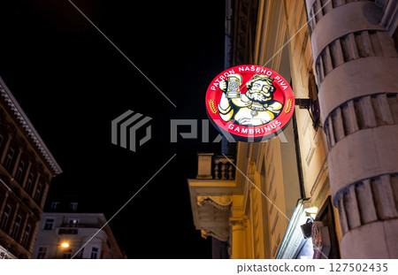 Prague, Czech Republic, August 4, 2023. Night shot highlighting the illuminated sign of a brewery with the most popular brand in the country. Prague, Czech Republic, August 4, 2023. Night shot highlighting the illuminated sign of a brewery with the most popular brand in the country. 127502435