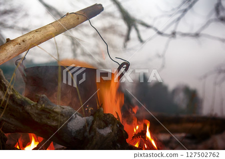 picnic in winter on nature of a bonfire 127502762