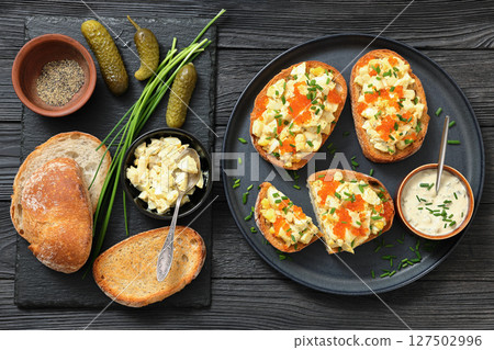 deviled egg salad and red caviar on toast deviled egg salad and red caviar on toast 127502996