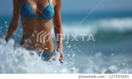 Woman in Polka Dot Bikini Splashing at Sea Woman in Polka Dot Bikini Splashing at Sea 127503093