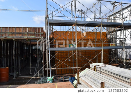 Scaffolding installed at construction site 127503292