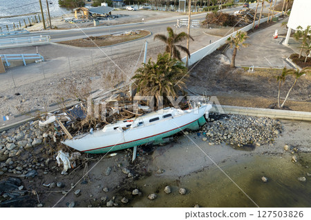 Destroyed yachts capsized on shore after hurricane Milton in Englewood, Florida 127503826