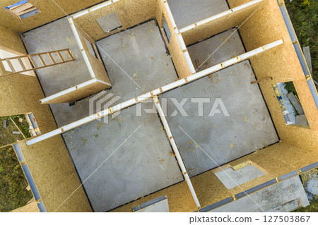 Construction of new and modern modular house. Walls made from composite wooden sip panels with styrofoam insulation inside. Building new frame of energy efficient home concept. 127503867