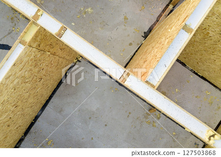 Construction of new and modern modular house. Walls made from composite wooden sip panels with styrofoam insulation inside. Building new frame of energy efficient home concept. 127503868